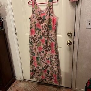 Very lovely long dress with colorful flowers. Size 14. Polyester liner on top.